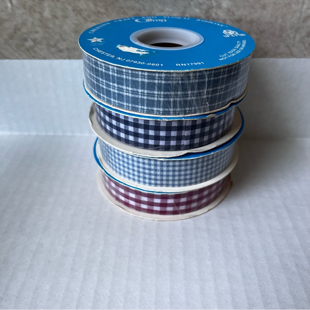 Plaid Offray Ribbon in Blue and wine  New and not opened. 4 reels of ribbon